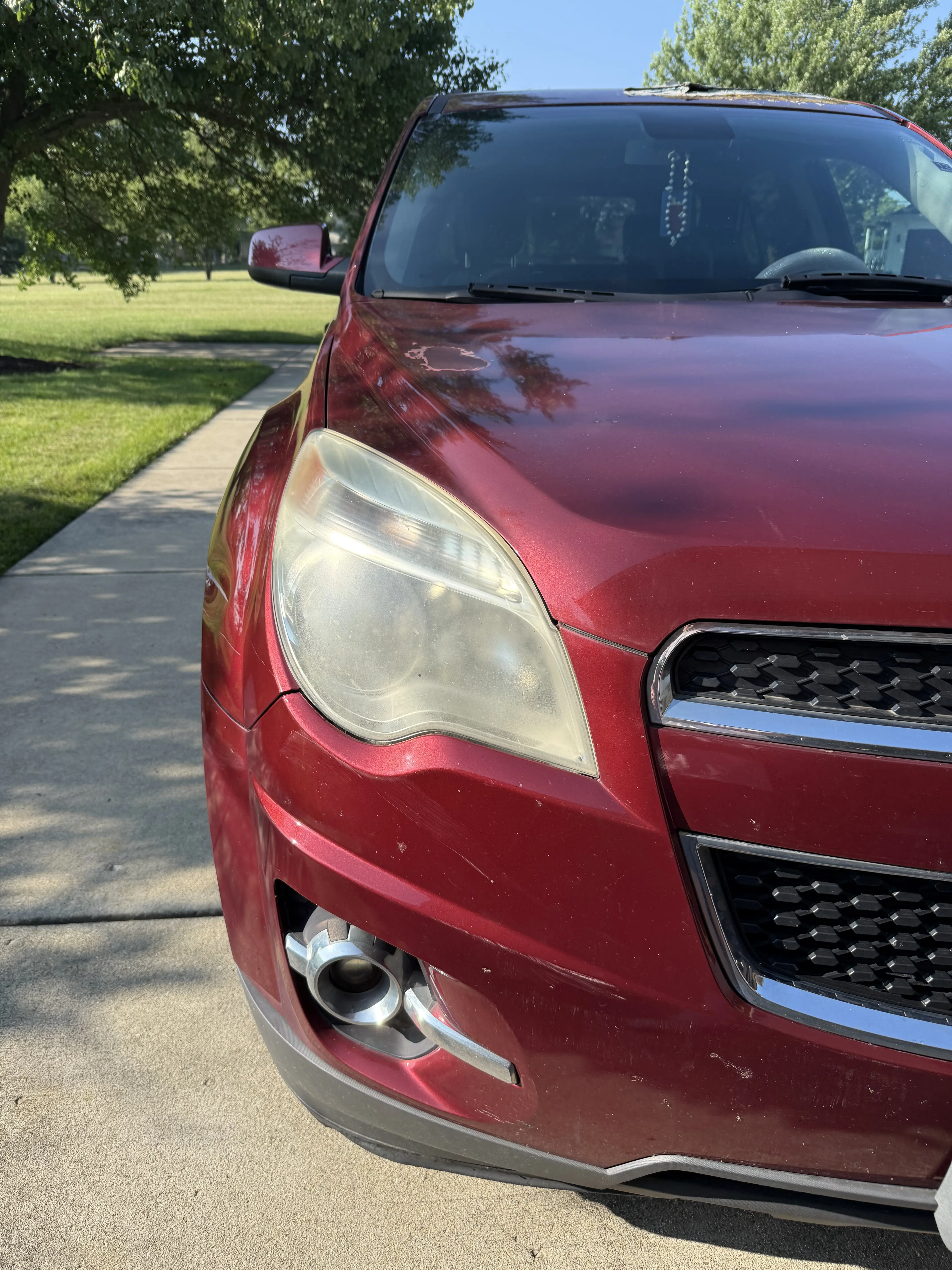 Before restoration: yellowed, hazy headlight lens